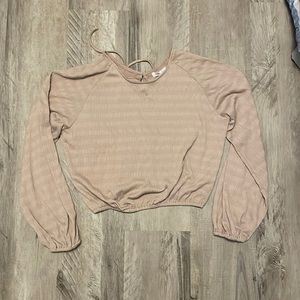 This is a later 2000’s long sleeved crop top.